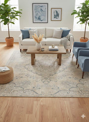 7' x 7' square beige and blue vintage medallion area rug styled in a bright living room with a neutral sofa, blue accent chairs, and light wood coffee table.