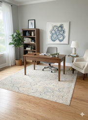 7' x 7' square beige and light gray vintage medallion area rug placed beneath a wooden desk in a modern home office with neutral decor.