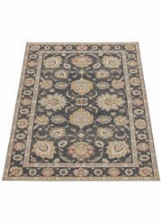 7' x 7' square charcoal, gold, and beige traditional area rug featuring an ornate floral pattern with a decorative border and classic design.