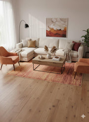 7' x 7' square terracotta and copper textured modern area rug styled in a warm contemporary living room with neutral sofa, terracotta accent chairs, and a wooden coffee table.