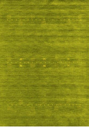 7' x 9' Abstract Green Olive Contemporary Area Rug full top view showcasing the rich olive-green background with subtle abstract linear textures and delicate dotted accents.