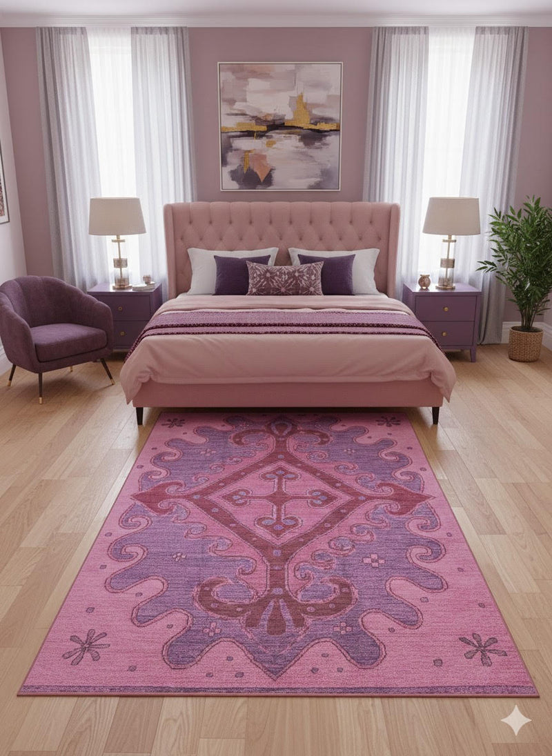 7' x 9' Pink Soft Purple Ornamental Washable Area Rug placed / styled in a bright modern bedroom.