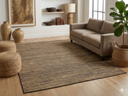 7' x 9' Rectangular Brown Beige Textured Jute-Style Farmhouse Washable Area Rug styled in a living room with a beige sofa, woven ottomans, and potted plants.