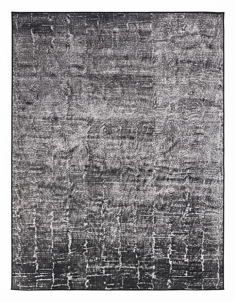 7' x 9' Rectangular Charcoal Gray Ivory Distressed Abstract Modern Washable Area Rug featuring an irregular textured pattern with faded ivory and gray accents, displayed in product view.