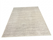7' x 9' Rectangular Light Gray Ivory Distressed Solid Modern Area Rug featuring subtle horizontal textured lines and soft gray tones over an ivory background, displayed in product view.