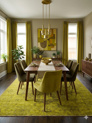 7' x 9' Rectangular Mustard Gold & Brown Distressed Medallion Traditional Washable Area Rug placed in a mid-century modern dining room beneath a wooden dining table.