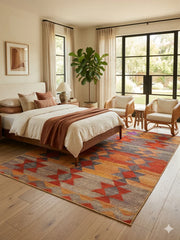 7' x 9' Rectangular Orange Multi Color Geometric Tribal Southwestern Area Rug styled in a bedroom with a wooden bed and white bedding.