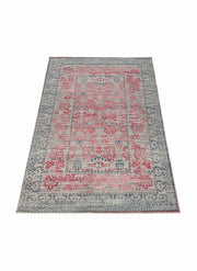 7' x 9' Rectangular Pink & Blue Gray Ivory Distressed Traditional Area Rug displayed alone on a white background studio setting.