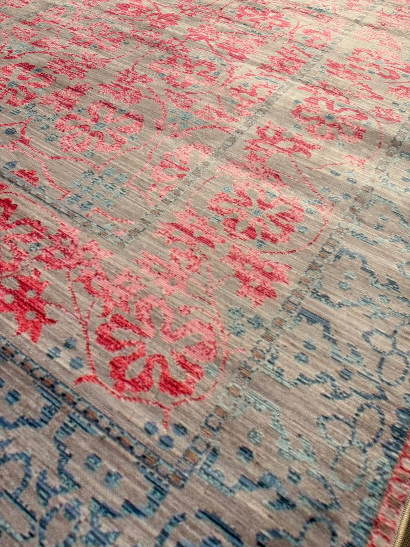 7' x 9' Rectangular Pink & Blue Gray Ivory Distressed Traditional Area Rug shown in a detailed close-up view highlighting the distressed floral pattern and texture.