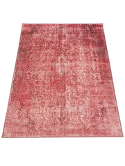 7' x 9' Rectangular Pink & Rose Distressed Oriental Vintage Area Rug displayed on a white background, showing its distressed Oriental pattern.