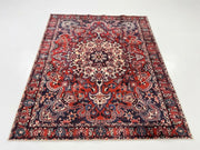 7' x 9' Rectangular Red Navy Ivory Floral Medallion Traditional Oriental Washable Area Rug featuring an ornate ivory central medallion, intricate floral patterns, and a decorative red border, displayed in product view.