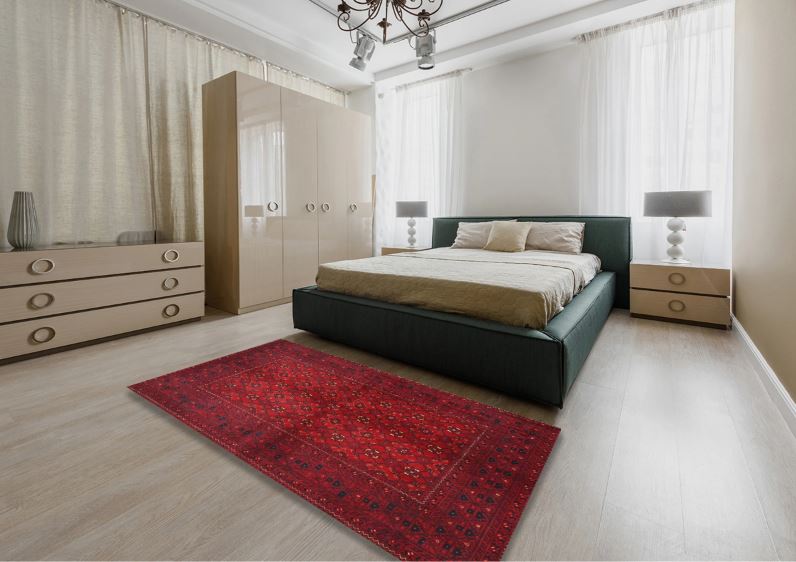 7' x 9' Traditional Red Burgundy Persian Area Rug styled in a contemporary bedroom setting, emphasizing the deep red color palette and detailed traditional pattern.