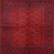 7' x 9' Traditional Red Burgundy Persian Area Rug thickness measurement image displaying the low-profile pile height next to a ruler for scale.