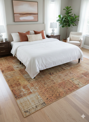 7'x 9' Warm Tan Cream & Rust Distressed Vintage Rectangular Washable Area Rug placed in bedroom setting.