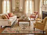 7' x 9' ivory multi-color floral tree traditional area rug styled in a classic living room with neutral sofa, coral accent pillows, and warm wood furniture.