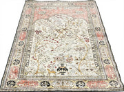 7' x 9' ivory multi-color traditional area rug featuring a detailed floral tree botanical pattern with decorative borders.
