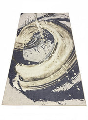 7' x 9' navy blue and beige cream abstract modern area rug featuring a bold swirling artistic pattern with soft textured detailing.