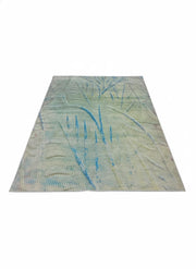 7' x 9' sage green, blue, and soft gray abstract modern area rug featuring fluid organic line patterns and a textured contemporary design.
