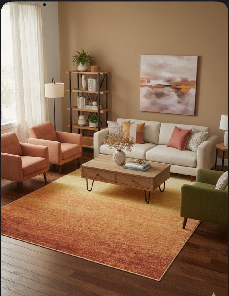 7' x 9' warm orange and golden yellow ombre washable area rug styled in a cozy living room with neutral seating and warm accent décor.