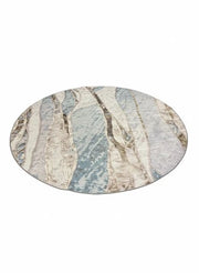8-foot round ivory and beige abstract marble design area rug featuring flowing stone-inspired patterns with soft blue and gray accents.