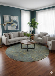 8' Round Blue & Sage Green Distressed Traditional Area Rug placed in living room under round coffee table seating area.