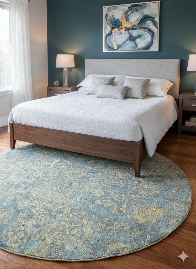 8' Round Blue & Sage Green Distressed Traditional Area Rug styled in bedroom under wooden bed frame.