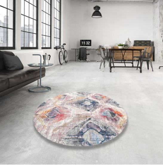 8' Round Ivory Multi Color Contemporary Modern Area Rug styled in an industrial loft living room, highlighting the abstract geometric pattern and soft neutral palette.