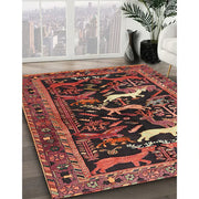 8 ft Square Rust Pink & Black Animal Motif Traditional Area Rug styled in a modern living room with large windows and indoor plant.
