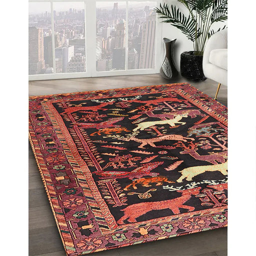 8 ft Square Rust Pink & Black Animal Motif Traditional Area Rug styled in a modern living room with large windows and indoor plant.