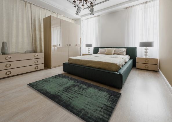 8' x 10' Charcoal Black Forest Green Traditional Persian Rug styled in a bright bedroom setting, emphasizing the rich dark color palette and modern aesthetic.