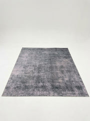 8' x 10' Rectangular Charcoal Gray & Light Gray Distressed Abstract Modern Washable Area Rug featuring a faded textured design with subtle silver accents, displayed in product view.