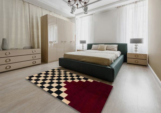 8' x 10' Rectangular Dark Almond Brown, Black & Red Geometric Checkerboard Abstract Modern Area Rug styled in a contemporary bedroom.