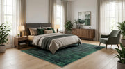 8' x 10' Rectangular Emerald Green Charcoal Distressed Abstract Modern Washable Area Rug placed in a bedroom with a gray upholstered bed and neutral bedding.