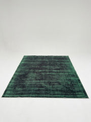 8' x 10' Rectangular Emerald Green & Charcoal Gray Distressed Abstract Modern Washable Area Rug featuring subtle horizontal textures and dark green accents, displayed in product view.