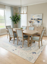 8' x 10' Rectangular Ivory/Cream & Mist Blue Abstract Vintage Washable Area Rug styled in dining room under wooden dining table.