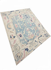 8' x 10' Rectangular Ivory/Cream & Mist Blue Distressed Abstract Vintage Washable Area Rug placed on white background product display.