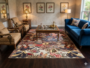 8' x 10' Rectangular Ivory Multicolor Pictorial Traditional Area Rug styled in a traditional living room with a royal blue sofa, ornate wooden coffee table, vintage upholstered armchairs, and botanical wall art.