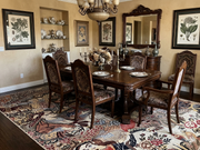 8' x 10' Rectangular Ivory Multicolor Pictorial Traditional Area Rug styled in an elegant dining room with a carved wooden dining table, ornate upholstered chairs, antique chandelier, and decorative botanical artwork.