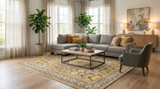 8' x 10' Rectangular Mustard Gold Ivory Geometric Medallion Traditional Washable Area Rug styled in a living room with a gray sectional sofa and wooden coffee table.