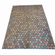 8' x 10' Rectangular Navy & Multicolor Repeating Geometric Modern Area Rug featuring small repeating geometric motifs in rust, gold, teal, and beige.