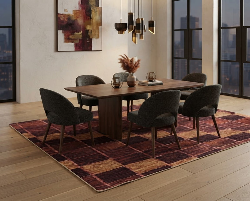 8' x 10' Rectangular Rust Brown Gold Checkered Geometric Modern Washable Area Rug styled in a dining room with a wooden table and dark gray upholstered chairs.
