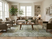 8' x 10' Rectangular Sage Green Ivory Distressed Floral Medallion Vintage Washable Area Rug styled in a living room with a beige sofa and wooden coffee table.