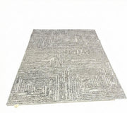 8' x 10' gray and ivory geometric area rug featuring a textured linear pattern with off-white accents for a modern contemporary look.