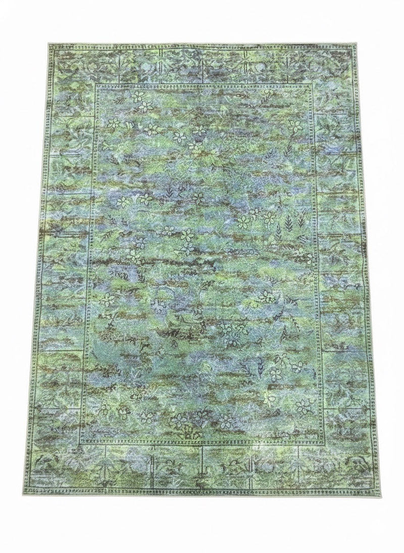8' x 10' light olive and moss green vintage botanical area rug featuring a subtle floral pattern with softly distressed detailing and a classic border design.