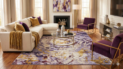 8' x 10' purple, gold, and ivory washable abstract floral area rug styled in an elegant living room with a neutral sectional sofa, plum accent chairs, and a glass coffee table.