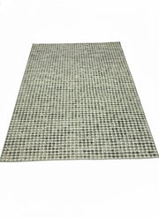 8' x 10' rectangular washable area rug featuring a soft sage green and cream geometric dot pattern with a modern textured woven look.
