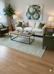 8' x 10' soft sage green washable geometric dot area rug styled in a contemporary living room with neutral seating, green accent chairs, and modern artwork.