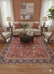 8' x 12' Multi Color Traditional Washable Area Rug placed / styled in a traditional living room with a cream sofa, matching armchairs, round wood coffee table, and coral accent wall.