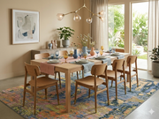 8' x 12' Rectangular Blue & Gold Abstract Modern Washable Area Rug styled in a bright dining room under a wooden dining table.