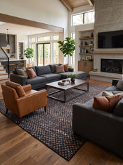 8' x 12' Rectangular Charcoal Black & Taupe Checkered Geometric Modern Washable Area Rug styled in a living room with gray sofas and a wooden coffee table.
